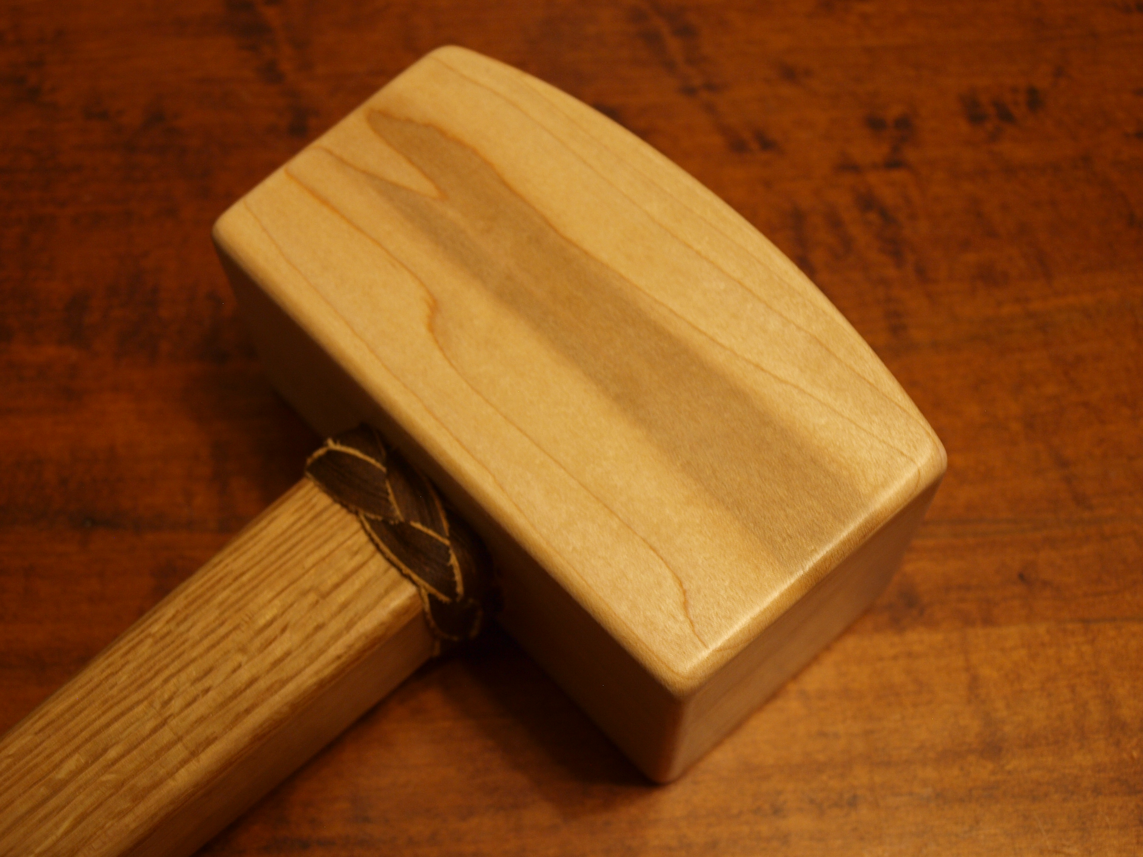 Custom wood mallets with leather features and grip.